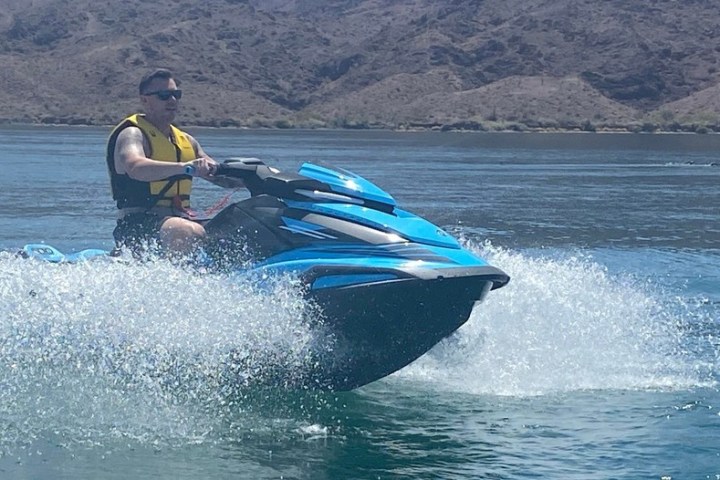a person riding a surf board on a body of water
