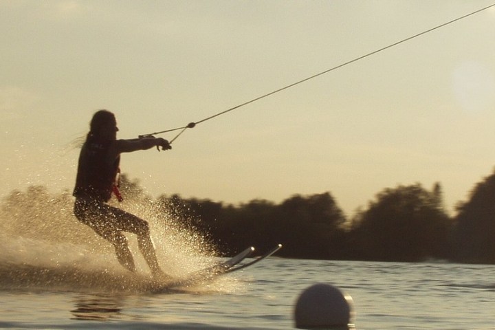 a man riding a wave on a surfboard in the water